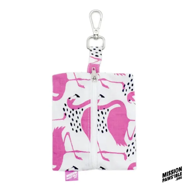 Flirty Flamingos Carry-All pouch featuring a pink flamingo pattern with a zipper and clasp, adorned with the "Mission Pawsible" logo in the corner.