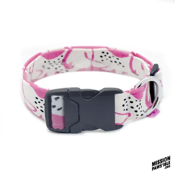 The Flirty Flamingos Collar is a pink and white dog collar with a black plastic buckle and metal D-ring, adorned with a pattern of black and pink spots. The "Mission Paws'ible" logo is displayed in the corner.