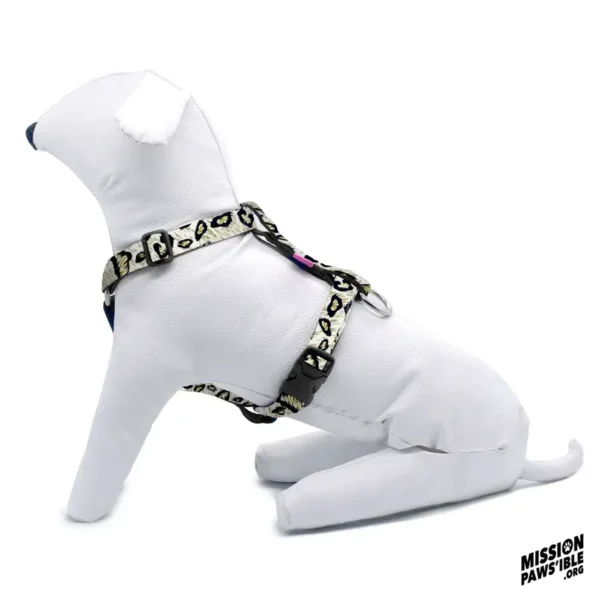 A white dog mannequin dons the Hear Me Roar Adjustable Harness, displayed in a patterned side profile with the Mission Pawssible logo in the corner.