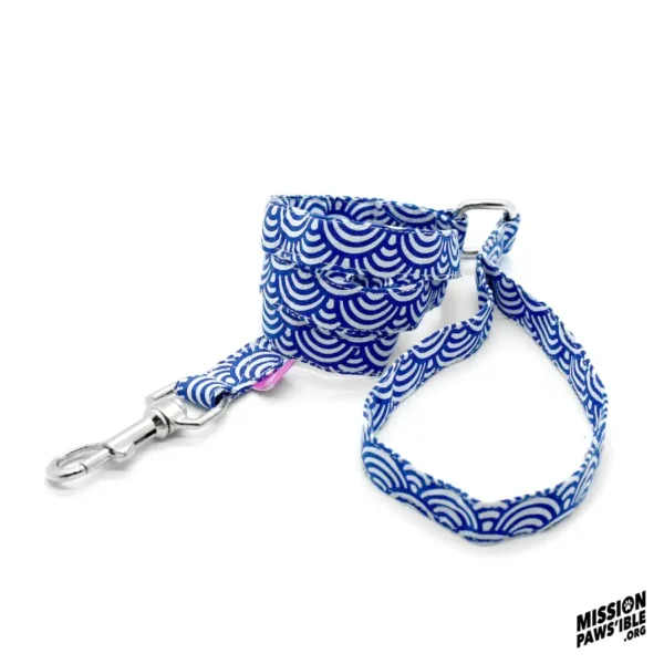 A Rollin In The Deep Lead, featuring a blue pattern and a metal clasp, coiled on a white background with the Mission Paws'ible logo in black at the bottom right.