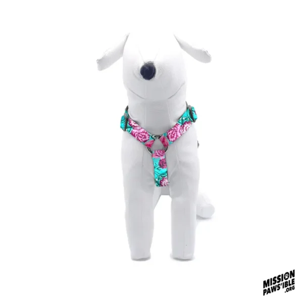 Stuffed dog mannequin wearing the Flower Power Aqua Adjustable Harness, featuring the Mission Paws'ible logo in the bottom right corner.