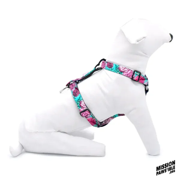 A white mannequin dog wearing the "Flower Power Aqua Adjustable Harness" sits against a plain white background.