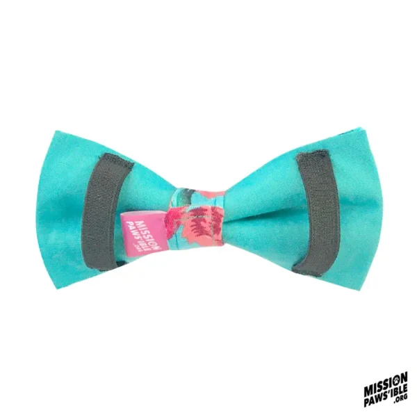 A bow tie in aqua with black accents and a floral center tag displaying "Mission Pawsible.