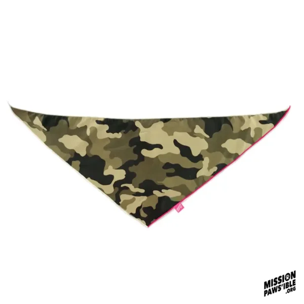 The Onyx Reversible Bandana is a triangular-shaped, camouflage-patterned accessory featuring red trim and the "Mission Paws'ible" label in the corner.