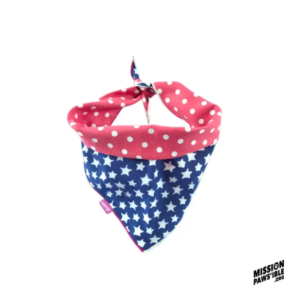 Introducing the Star Spangle Reversible Bandana, featuring a vibrant design of red and blue adorned with white polka dots and stars, complete with the "Mission Paws'ible" logo in the corner.