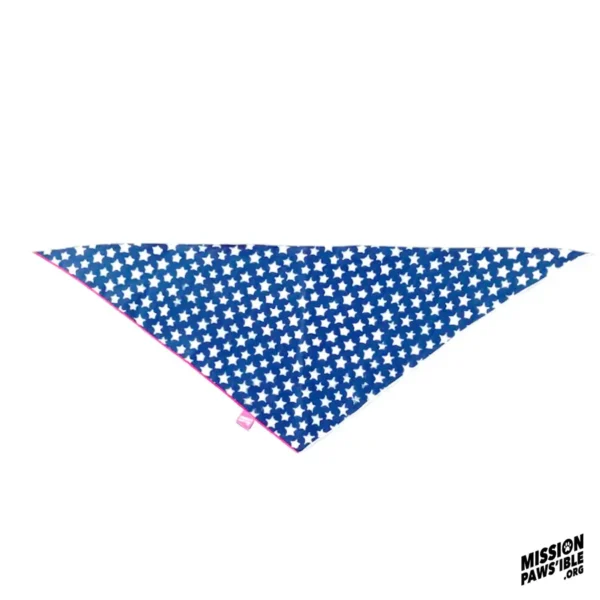 Star Spangle Reversible Bandana with a blue background, white stars pattern, pink trim, and featuring a Mission Paws'ible tag.