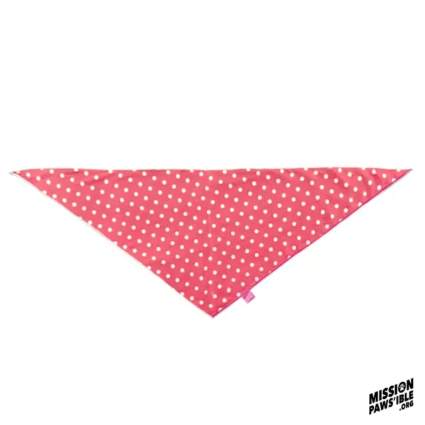 A red triangular Star Spangle Reversible Bandana adorned with white polka dots, set against a white background with the "Mission Paws'ible" logo displayed in the bottom right corner.