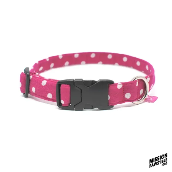 Polka Face Pink Collar, adorned with pink polka dots and equipped with a sturdy black plastic buckle along with a metal ring, features the "Mission Pawsible" logo in the corner.