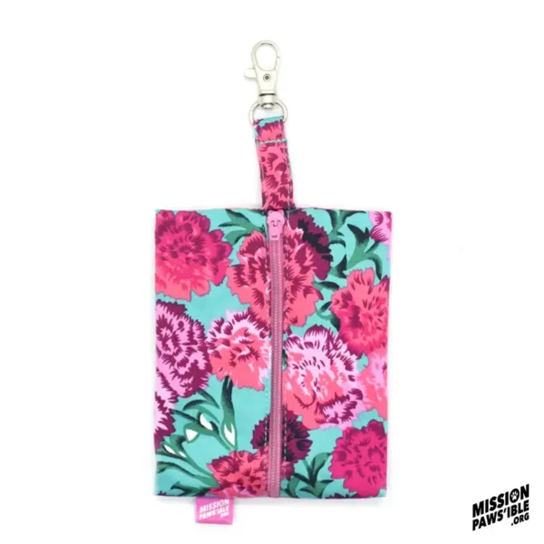 Flower Power Aqua Carry-All with a zipper and metal clasp, showcasing pink and red flowers on a teal background, complete with the Mission Paws'ible logo in the bottom right corner.