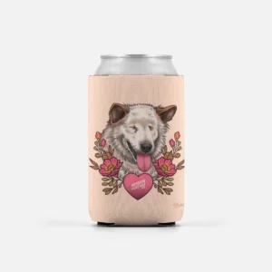 A can with the Stevie Wonder Can Cooler by artist Rik Lee features a beige koozie adorned with a winking dog sticking its tongue out, surrounded by flowers and an inscription in the shape of a heart that reads "Mission Paws'ible.