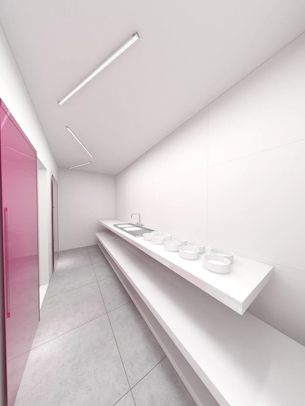 Minimalist kitchen with white countertops, four bowls, a sink, and pink cabinet doors. White walls and ceiling, gray floor tiles, and linear ceiling lights.